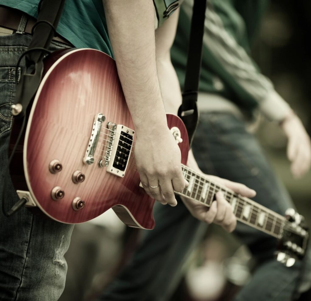 A man holding a guitar